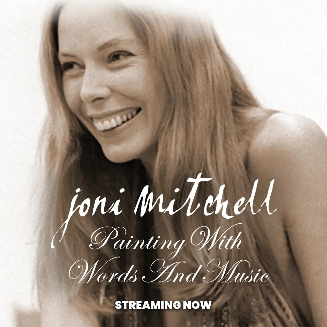A woman smiling, with text overlay: "Joni Mitchell Painting With Words And Music Streaming Now.
