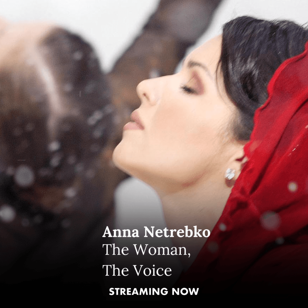 A woman in a red headscarf with closed eyes and pearl earrings is shown in profile, with snow falling around her. Text reads: "Anna Netrebko The Woman, The Voice. Streaming now.