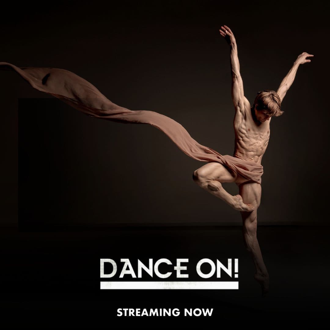 A male dancer leaps gracefully with arms raised, wearing a flowing fabric. Text reads “DANCE ON! STREAMING NOW” on a dark background.